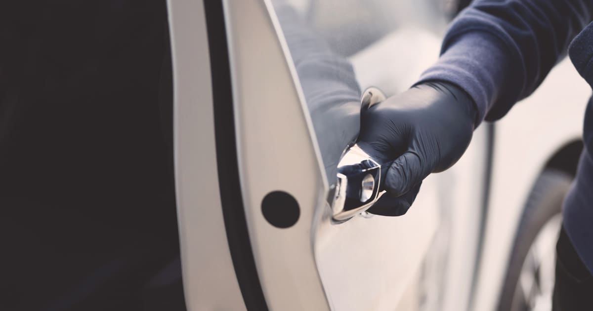 IMPACT News Article Regarding Car Theft in Ontario A car door is being opened by a gloved hand. The car is beige in colour and it is day time.